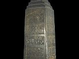 British Museum Top 20 14-1 Black Obelisk 14. Black obelisk of Shalmaneser III, 825BC, Nimrod (northern Iraq), 198cm high. The Black Obelisk was erected as a public monument in 825BC at a time of civil war. The relief sculptures on the black alabaster glorify the achievements of King Shalmaneser III (reigned Assyria 858-824 BC) and his chief minister. It lists their military campaigns of 31 years and the tribute they exacted from the kings they had conquered, including camels, monkeys, an elephant and a rhinoceros. There are five scenes of tribute, each of which occupies four panels round the face of the obelisk.